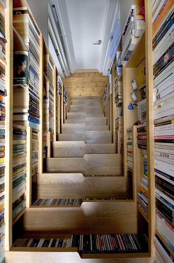 Bookshelves everywhere around the staircase