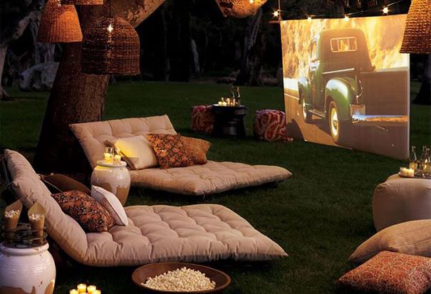 An outside cinema with large pillows