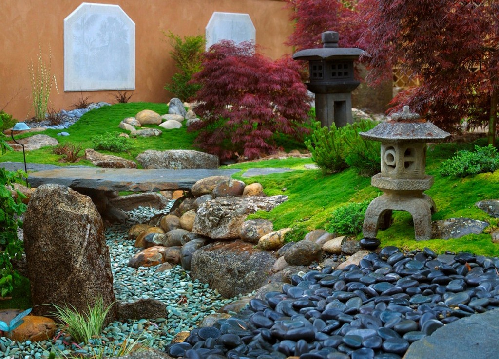 A classic Japanese garden with rocks and stones in a manor house setting.