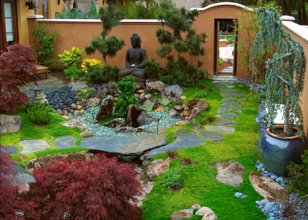 A classic manor garden featuring a Buddha statue.