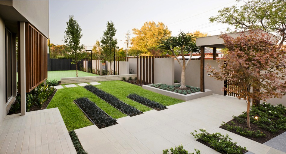 A classic backyard with grass and trees.