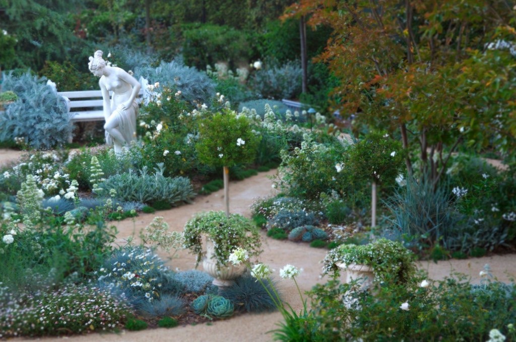 A classic garden with a statue.
