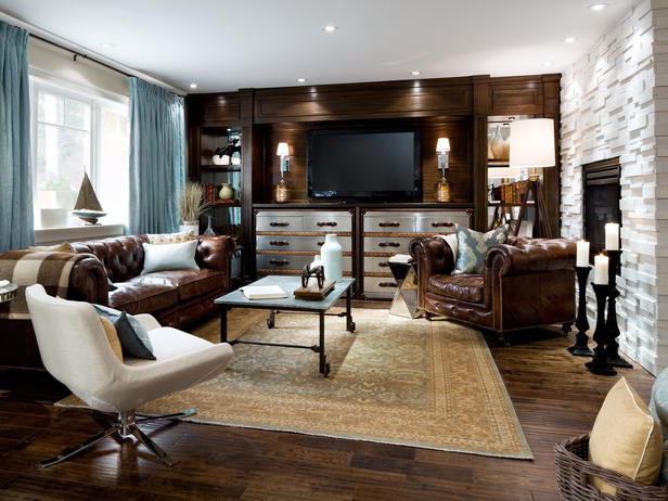 A living room with brown leather furniture and a TV, featured in the Top 12 Living Rooms by Candice Olson.