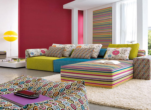 A colorful living room with striped furniture perfect for celebrating the New Year.