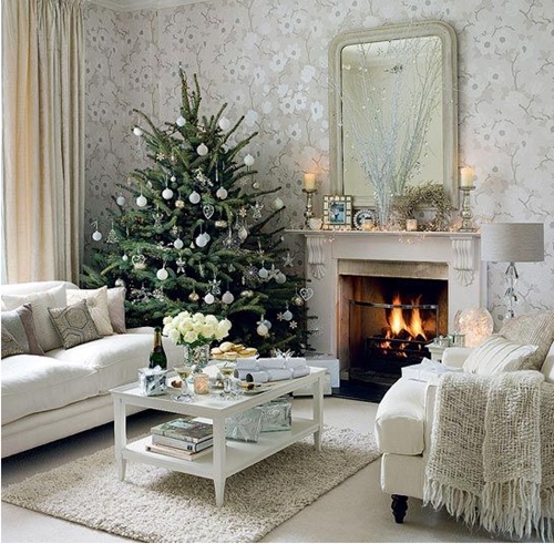 Interior Design Ideas: A white living room with a Christmas tree and a fireplace, perfect for winter.