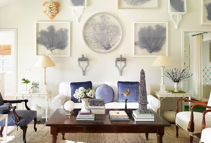 A living room with a blue and white decor featuring a coffee table.