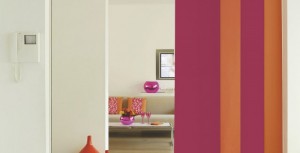 This pink and yellow vertical panel room divider gives a room a lively look.