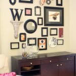 A white dresser used to create a collage in a living room.