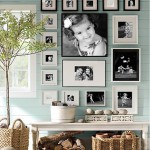Using framed pictures and a bench, create a collage in a living room.