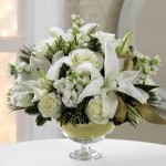Winter Floral Arrangements featuring the ftd christmas bouquet in a glass vase.