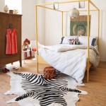 A bedroom with a zebra print rug designed for world travelers.