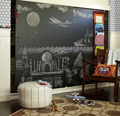 A child's room with a chalkboard.