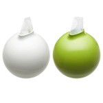 Two green and white tissue balls on a background.