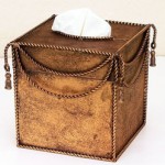 A brown box with tassels that can hide tissue boxes.
