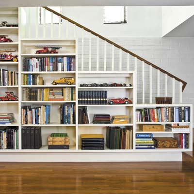 A staircase with built-in bookshelves.