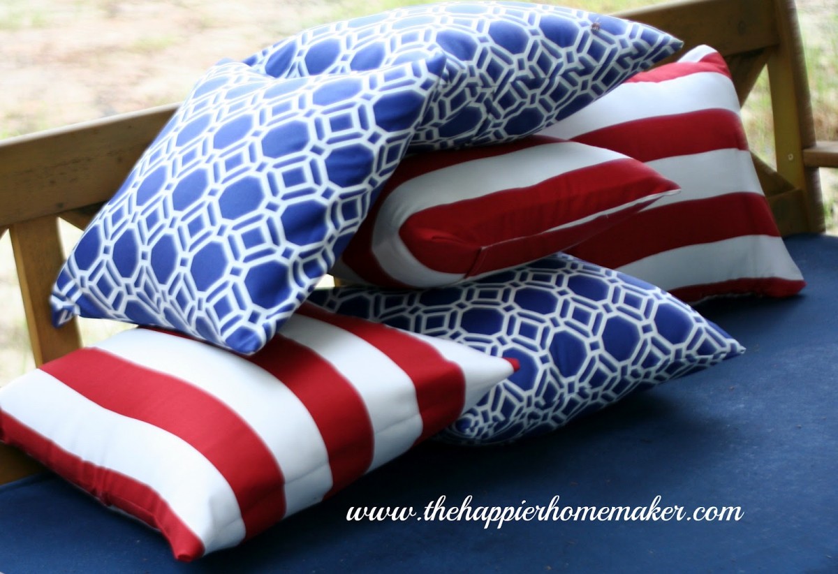 DIY 4th of July pillows on a wooden bench.