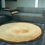A rug made from a tree stump in a living room. Keywords: living room