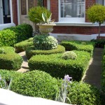 This is a front yard with shrubbery designs.