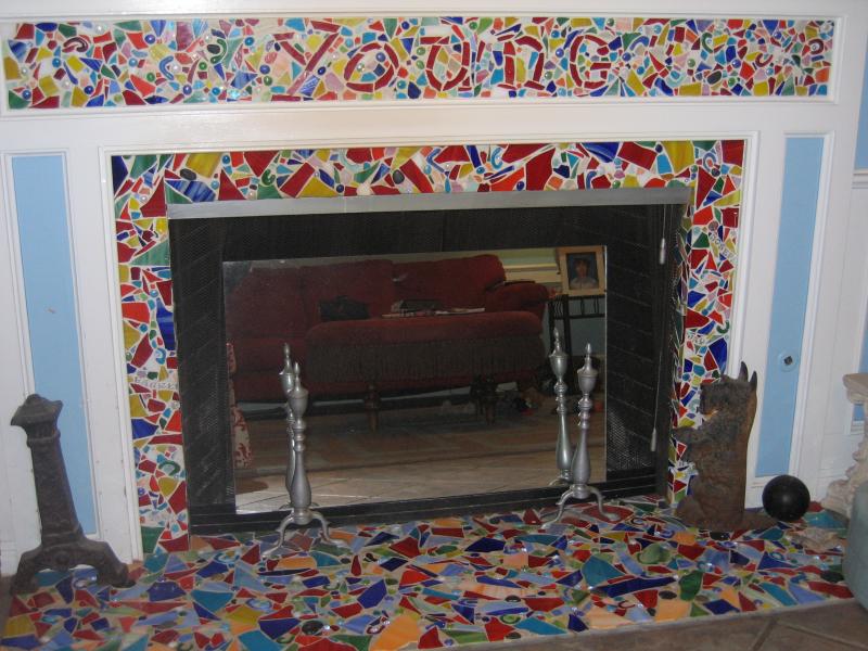 A fireplace with a tiled mantle.