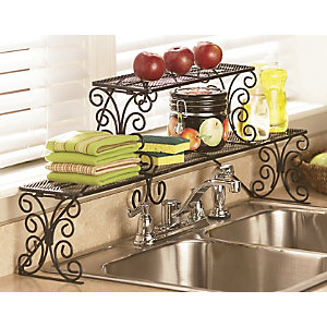 A clutter-free kitchen counter with an apple on top.