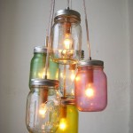 Colorful diy light fixture with mason jars hanging from a ceiling.