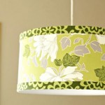 A green and white lamp shade with a floral pattern for a DIY light fixture.