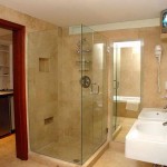 A bathroom with a unique glass shower door.