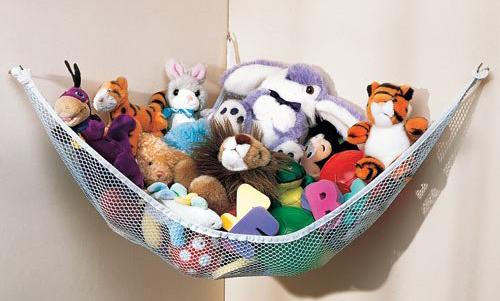 A pet toy storage hammock hanging on a wall.