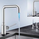 A kitchen faucet with a distinctive blue and red water stream.