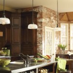 A kitchen with brown cabinets and a top counter.