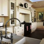A kitchen with white cabinets and a sink showcasing one of the top 15 best-looking kitchen faucets.