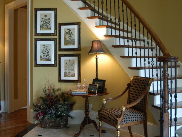 Foyer with stairway and chair.