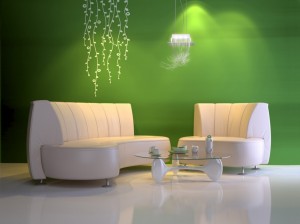 Summer decorating ideas for a living room with green walls and white furniture.