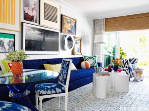 A living room in an apartment with blue and white furniture.