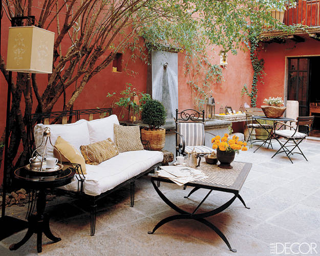 A terrace with a table and chairs.