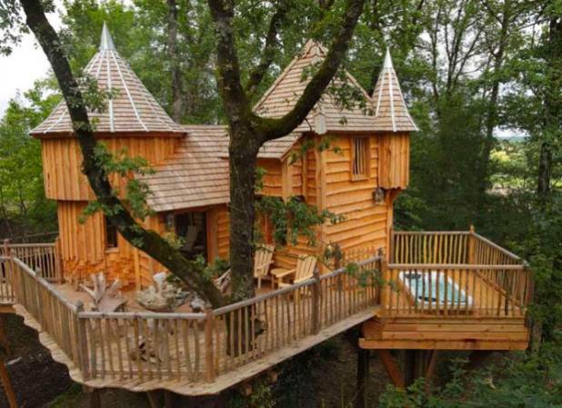 A rustic treehouse nestled in the woods.