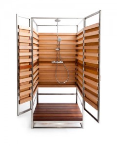 A wooden shower stall with a water-spraying feature.