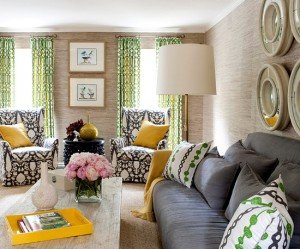 A living room with yellow and gray accents, mixing patterns.