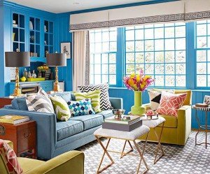 A living room with colorful furniture mixing patterns.