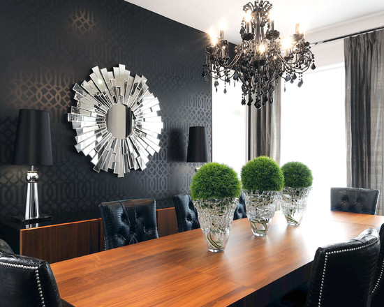 A black dining room with a stylish table and chairs.