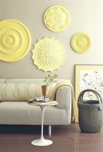 A living room with yellow wall decor.