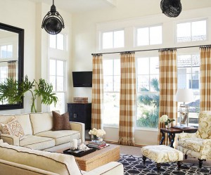 A living room with casual elegance, featuring beige curtains and a coffee table.