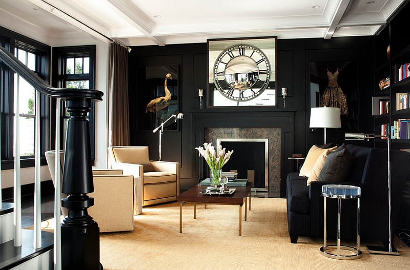 A living room with black walls decorated with a clock.