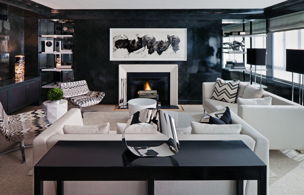A black and white living room with a fireplace decorated in black.