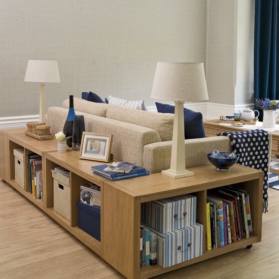 A living room with space-saving bookshelves and a sofa.