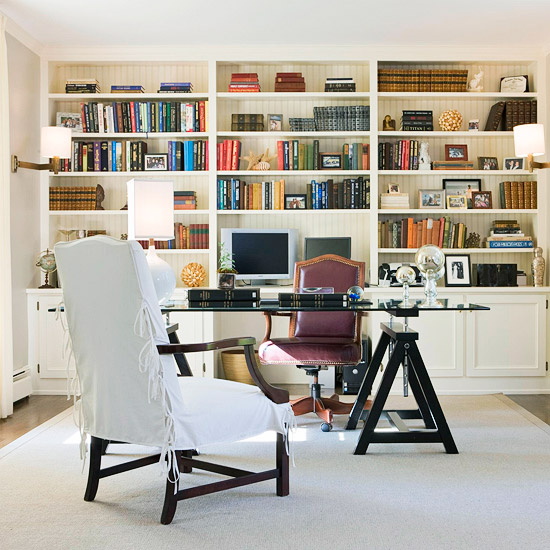 A home office with beautifully decorated bookshelves.