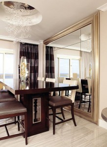 A dining room with a large mirror for decorating.