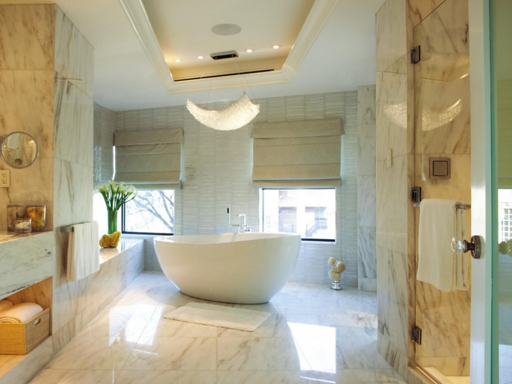 A large bathtub in a white bathroom.