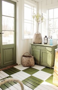 A room with a green and white checkered floor in cottage-style decorating.