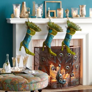 Decorating Christmas stockings on a fireplace mantel.